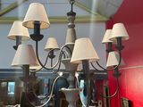 a chandelier that has a lot of lamps on it