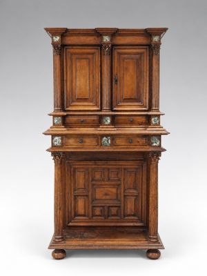an old wooden cabinet with two drawers and a door