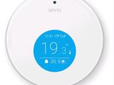 a white smart thermosta with a blue button on it