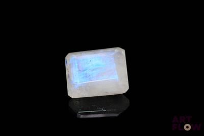 an image of a white stone with a blue light on it