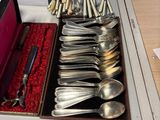 a lot of spoons and spoon spoons in a box