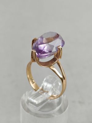 a close up of a ring with an amethorate stone in it