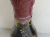a bottle of wine that is sitting on a table