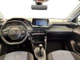 the interior of a small car with a steering wheel and dashboard