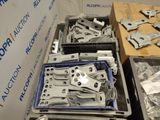 boxes of assorted metal parts are stacked on top of each other