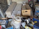 a pile of assorted items sitting on the floor