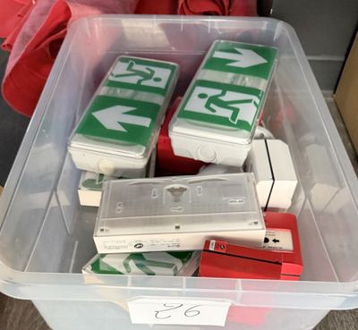 a plastic container filled with assorted items on the floor