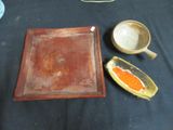 two bowls and a tray sitting on a table