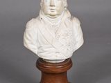 marble bust of a man on a wooden base