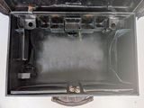 a black suitcase with a handle that is open