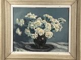 painting of white flowers in a black vase on a table