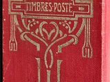 a red book with a silver cross on it