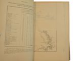 an open book with a map on it on a table