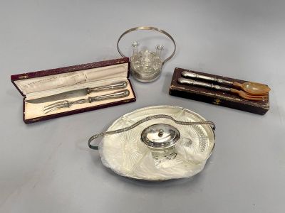 a silver tray with silverware and a glass on it