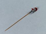 a small toothpick with a red head on it in the snow