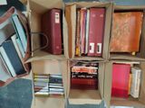 many books that are in a box on the floor