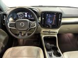 the interior of a car with a steering wheel, dashboard, and dashboard controls