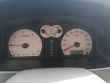 a close up of a car dashboard with gauges and numbers