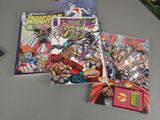 three comic books sitting on top of a table next to a plant