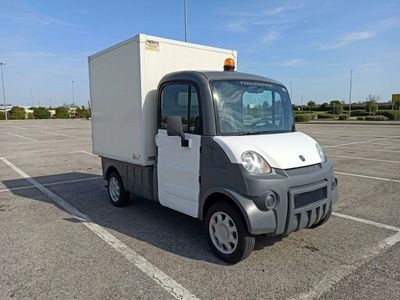 a small truck that is parked in a parking lot