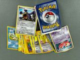 a lot of pokemon cards sitting on a table