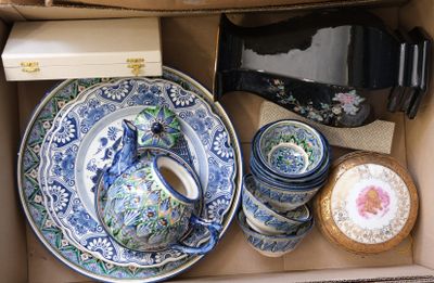 a box full of blue and white plates and bowls