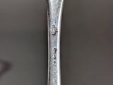 a close up of a spoon with a face on it
