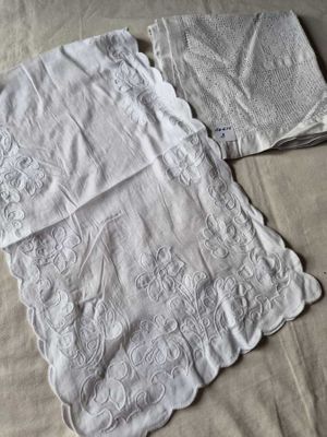 two towels that are laying on a bed
