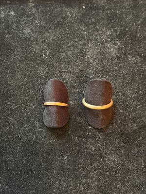 two pieces of chocolate sitting on a counter top