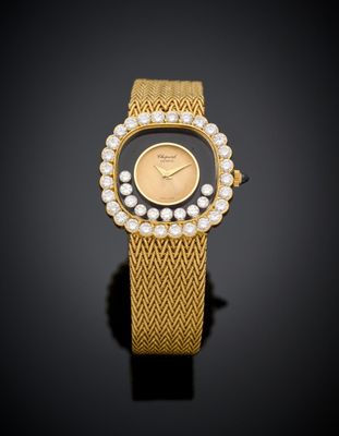 a lady ' s gold and pearl wrist watch