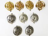 a set of six gold and silver pendants with a picture of a ship