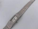 an image of a wrist watch with a diamond on the face