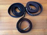 three different types of rope are laid out on a wooden table