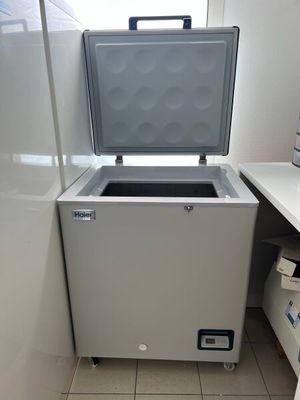 an image of a freezer in the corner of a kitchen