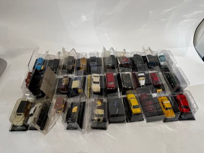 a lot of toy cars that are sitting on a table