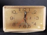 a small clock that is sitting on a table