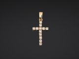 a diamond cross pendant on a black background