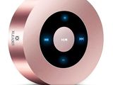 On voit l'image d'une enceinte Bluetooth rose sur fond blanc.