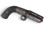 a close up of an old gun on a white background