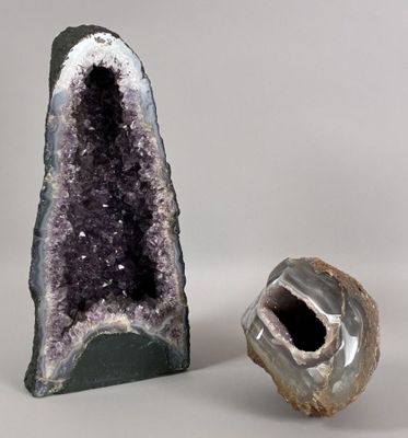 two pieces of amethorate are sitting next to each other on a white surface