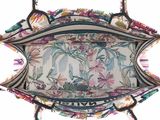 the inside of a purse with a floral pattern on it