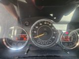 a close up of a speedometer and gauges in a car