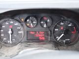 a close up of a car dashboard with a clock on it