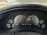 a close up of a car dashboard with a speedometer