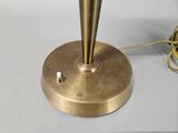 a lamp that is sitting on a table next to a cord