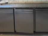 a kitchen with stainless steel appliances and a granite counter top
