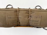 a tan bag that has two straps on it