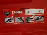 au dos d'une boîte rouge contenant le mode d'emploi d'un T-Max