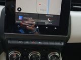 the dashboard of a car with a gps device in the center of it