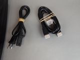 two cables that are connected to a laptop on the table